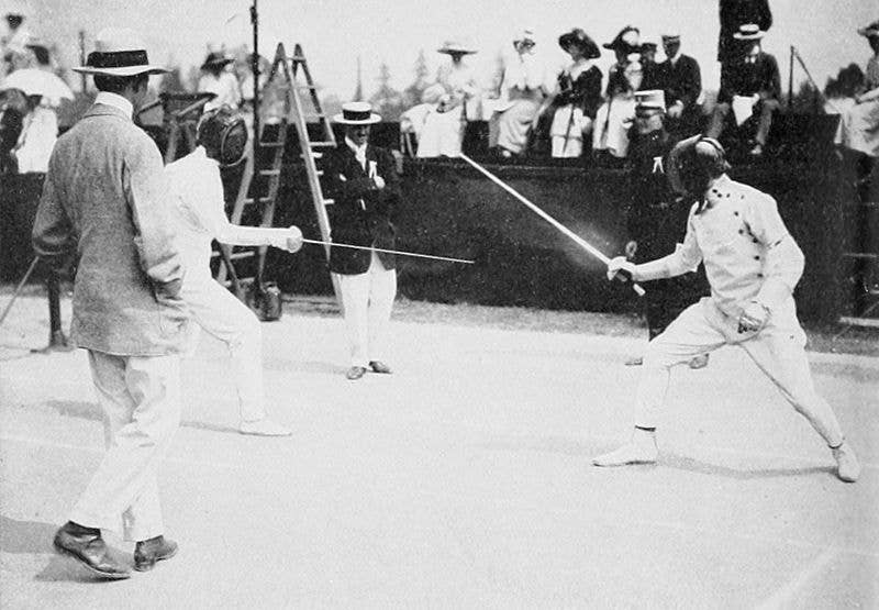Patton (right) fencing in the <a href="https://en.wikipedia.org/wiki/Modern_pentathlon_at_the_1912_Summer_Olympics">modern pentathlon</a> of the <a href="https://en.wikipedia.org/wiki/1912_Summer_Olympics">1912 Summer Olympics</a>.
