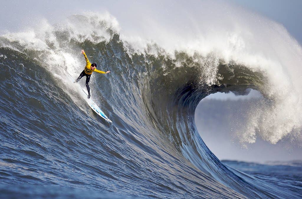 A surfer at <a href="https://en.wikipedia.org/wiki/Mavericks_(location)">Mavericks</a>, one of the world's premier big wave surfing locations.
