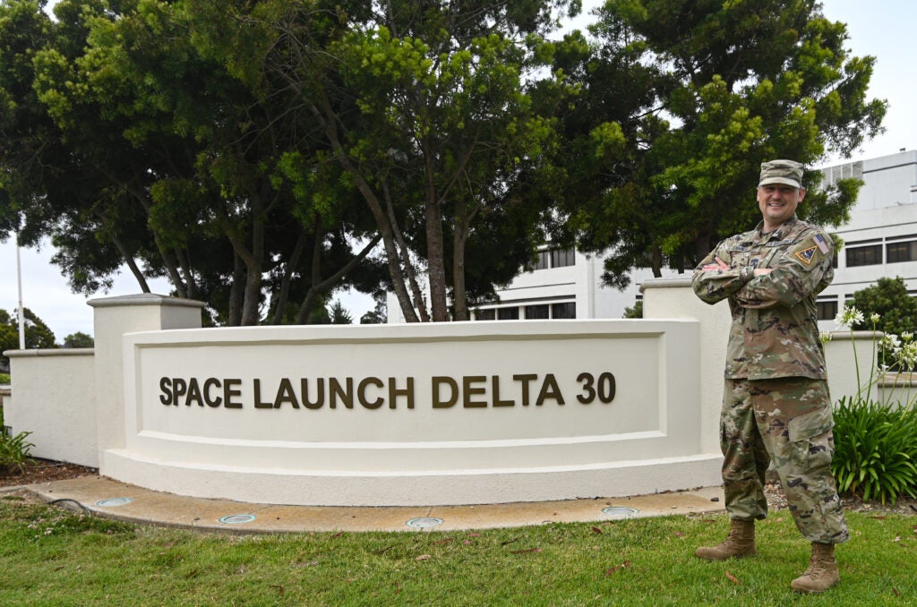Chief Master Sgt. Heath Jennings, Space Launch Delta 30 Senior Enlisted Leader, poses for a photo in front of SLD 30 headquarters on Vandenberg Space Force Base