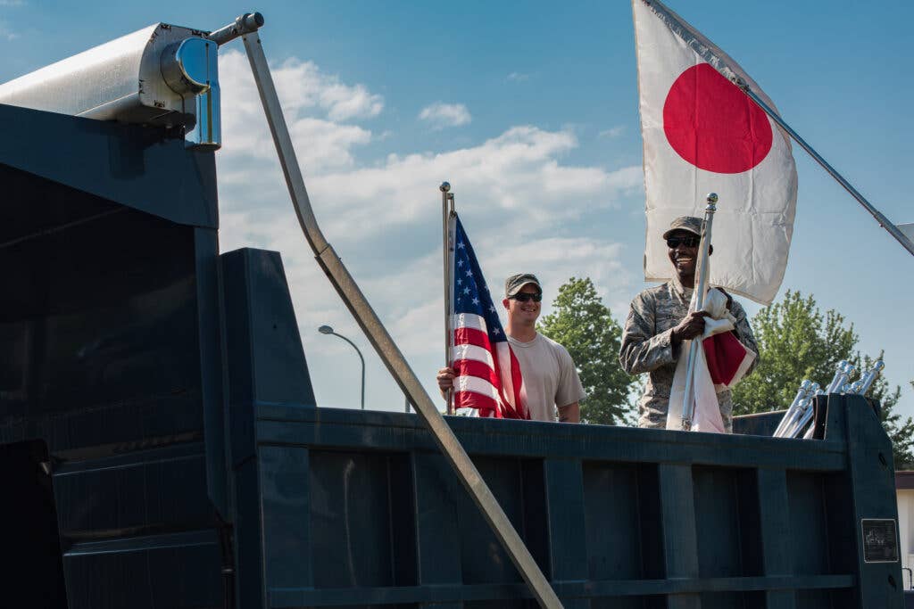 Japanese and American flags along the main street at Yokota Air Base