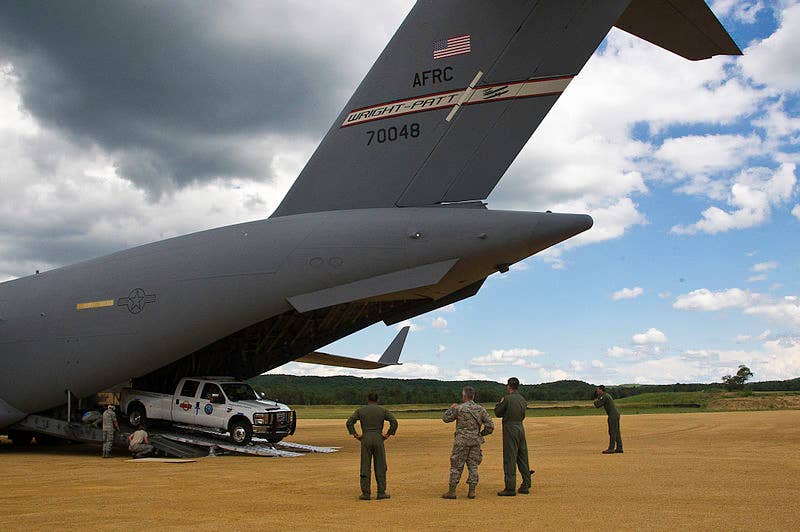 Equipment is unloaded from a <a href="https://en.wikipedia.org/wiki/Boeing_C-17_Globemaster_III">C-17A Globemaster III</a> of the <a href="https://en.wikipedia.org/wiki/89th_Airlift_Squadron">89th Airlift Squadron</a> based at Wright-Patterson AFB.