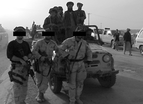 <em>Special Forces soldiers with Northern Alliance fighters in Mazar-i-Sharif, November 2001 (U.S. Army)</em>