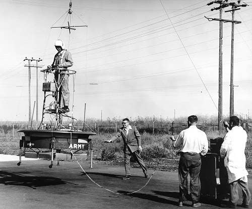 <em>Testing on the flying platform included a suspended high wire for pilot safety (Public Domain)</em>