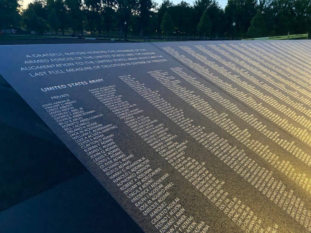 <em>Sunlight reflects off of the Wall of Remembrance (Korean War Veterans Memorial Foundation)</em>