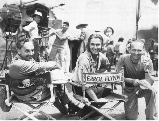Mohr (left) with Errol Flynn on set. Photo courtesy of filmreference.com.