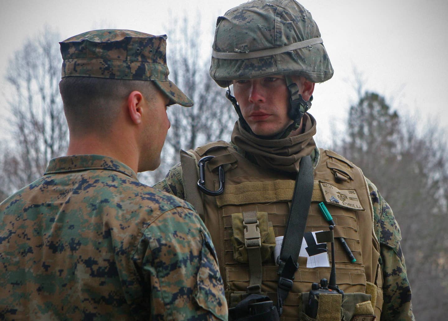 FORT PICKETT, VA - Sergeant Anthony V. Palmer (left), a squad leader with Company G, 2nd Battalion, 6th Marine Regiment, 2nd Marine Division, speaks with Cpl. Adam J. Butherus, a squad leader with Company B, 1st Battalion, 9th Marine Regiment, 2nd Marine Division, before a patrol. (USMC photo)
