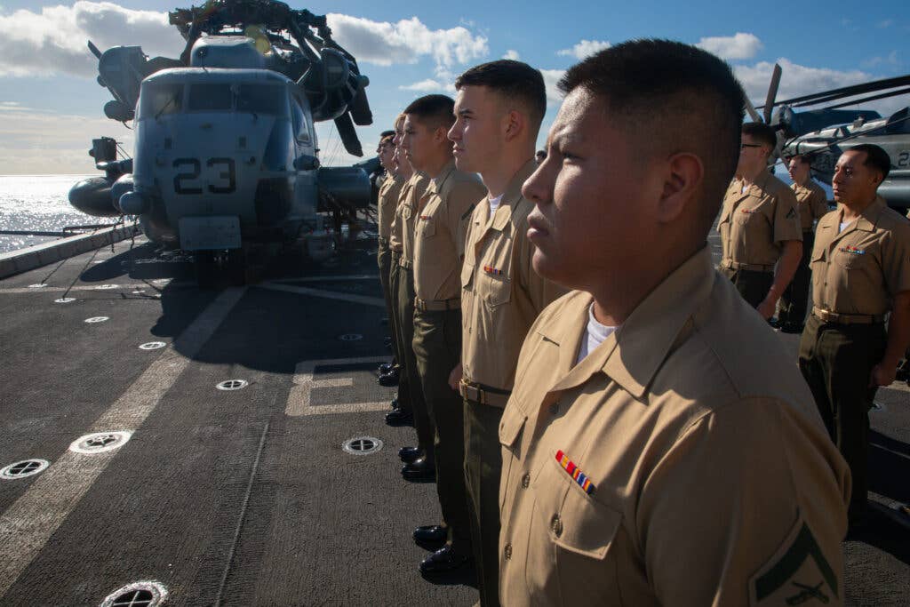 U.S. Marines attached to San Antonio-class amphibious transport dock ship USS Arlington (LPD 24) conduct a uniform inspection aboard Arlington, April 25, 2022. Kearsarge Amphibious Ready group and 22nd Marine Expeditionary Unit are on a scheduled deployment under the command and control of Task Force 61/2 while operating in U.S. 6th Fleet in support of U.S., allied and partner interests in Europe and Africa. (U.S. Marine Corps photo by Lance Cpl. Cameron Ross)