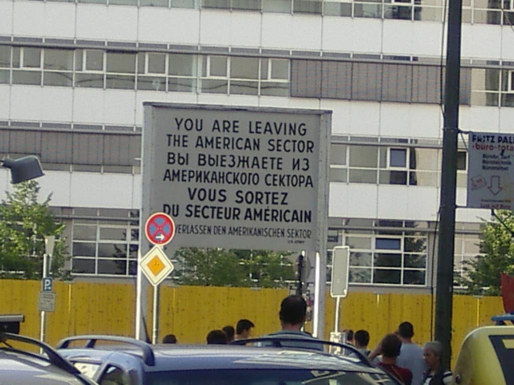 A <em>You Are Leaving</em> sign at a border of the American sector.