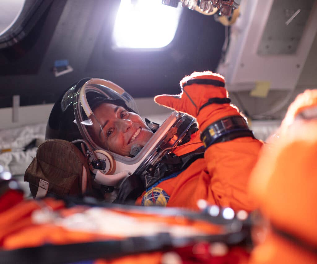 <em>NASA astronaut Nicole Mann gives a thumbs up from inside the Orion mockup, July 10, 2019 at NASA's Johnson Space Center in Houston, Texas. Photo Credit: (NASA/Bill Ingalls)</em>