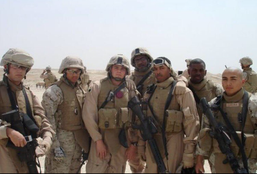 Herring with his fellow Marines in Iraq. From left to right: David Van Briggle, Andrew McMillan, unknown, Stephen Simms, Robert Tomkins, Jamel Herring, and Martin Corona. Photo courtesy of @jamelherring.