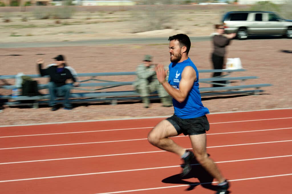 Daniel Crane, 2015 U.S. Air Force Trials participant, sprints toward the finish line during a 100-meter dash at Nellis Air Force Base, Nev., March 3, 2015. Crane finished the race in first place. (U.S. Air Force photo by Senior Airman Timothy Young)
