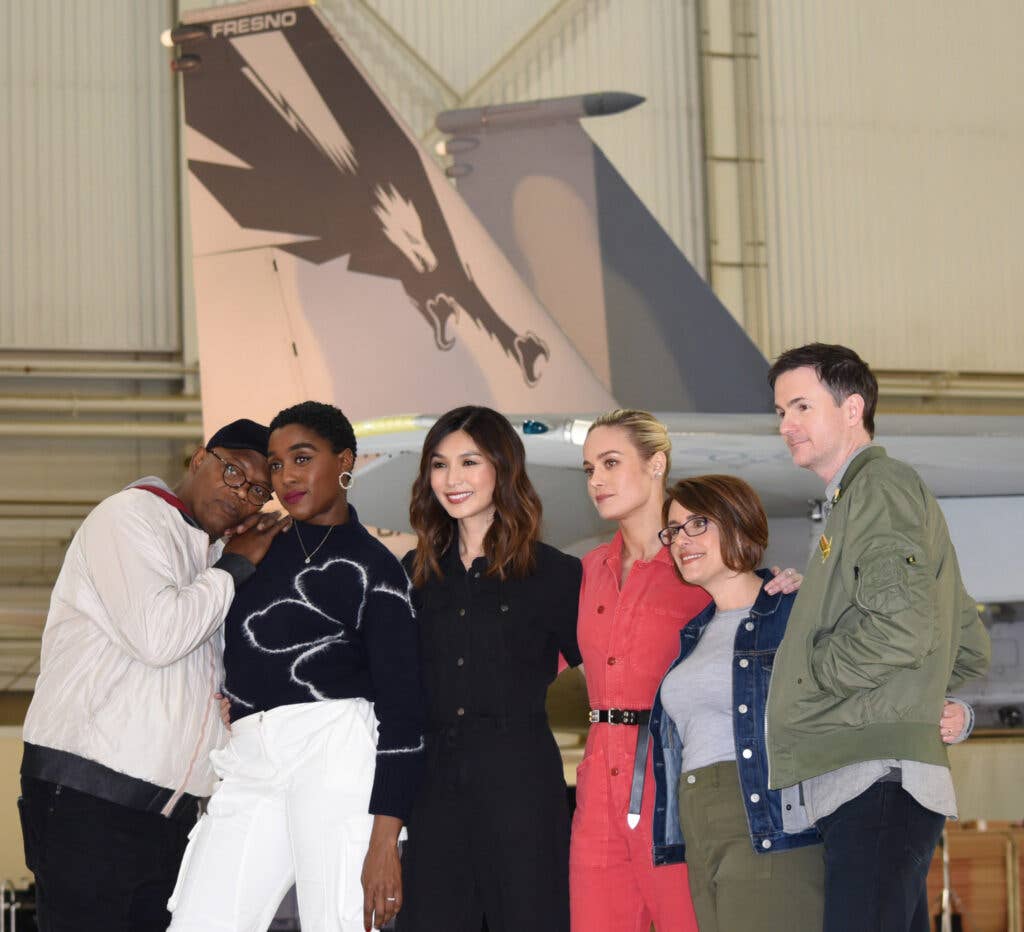 "Captain Marvel" cast members Samuel L. Jackson, Lashana Lynch, Gemma Chan and Brie Larson, along with directors Ryan Fleck and Anna Boden, pose in front of an Air Force F-15 Eagle from the 144th Fighter Wing, Fresno Air National Guard, California, during a media event at Edwards Air Force Base, Caliifornia, Feb. 20, 2019. (DOD photo by Shannon Collins)
