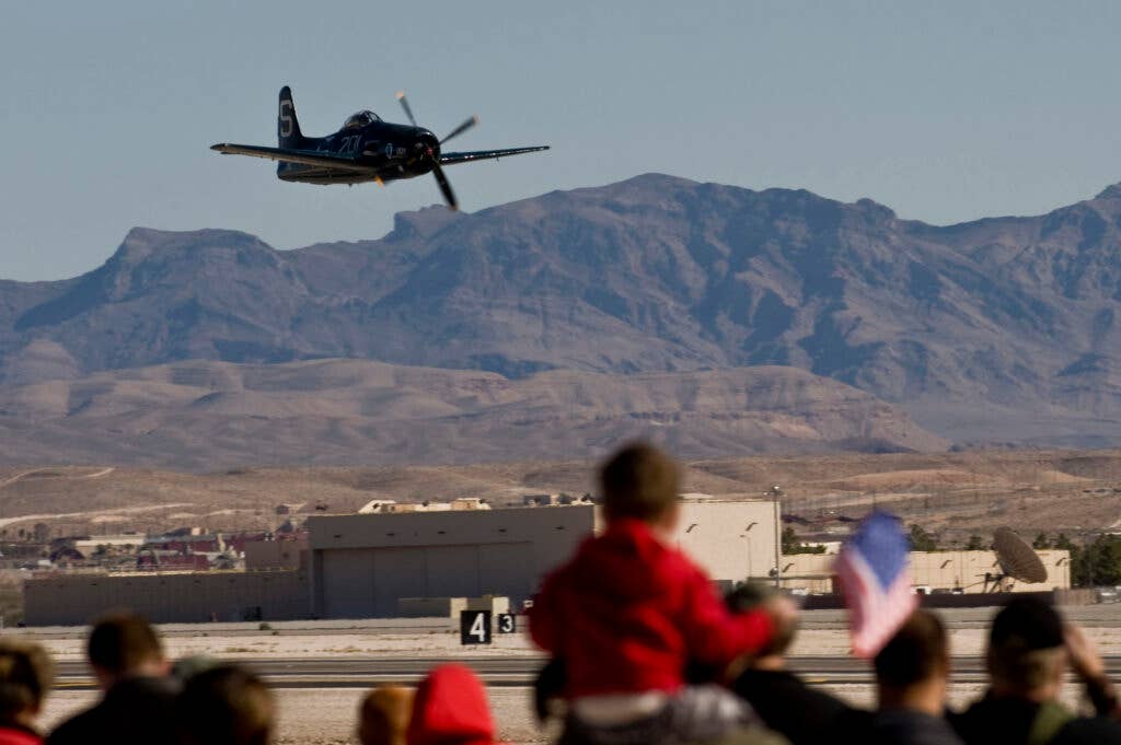A T-1 Skyraider flies by the crowd during Aviation Nation 2012 Nov. 10, 2012, at Nellis Air Force Base, Nev. The T-1 Skyraider was an American single-seat aircraft that saw service between the late 1940s and early 1980s. (U.S. Air Force Photo By Senior Airman Daniel Hughes)