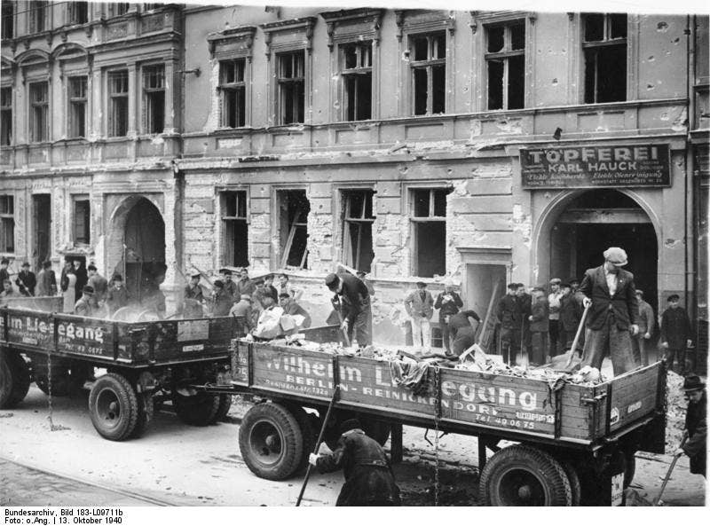 A work party clears rubble from an air raid on Berlin, 13 October 1940.