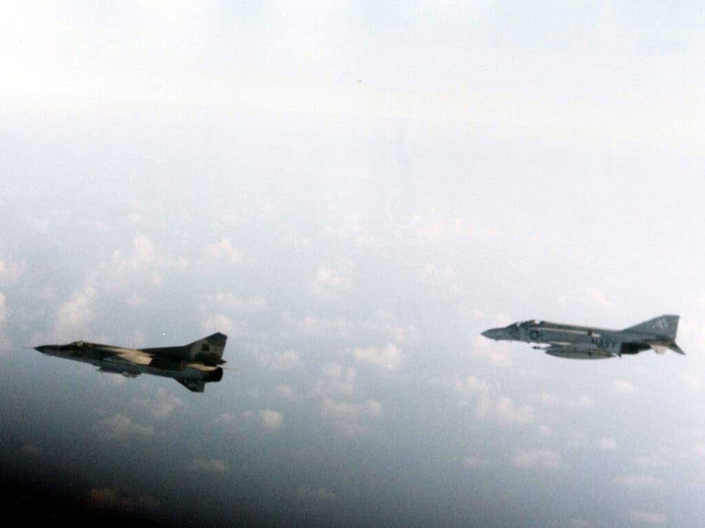 <em>An F-4 Phantom II of VF-74 from the USS </em>Forrestal<em> escorts a Libyan MiG-23 Flogger away from the carrier group in August 1981 (U.S. Navy)</em>