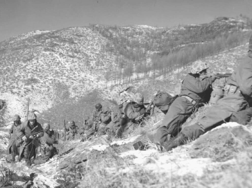 Marines taking cover at the Battle of the Chosin Reservoir. Photo courtesy of chosinfew.org.