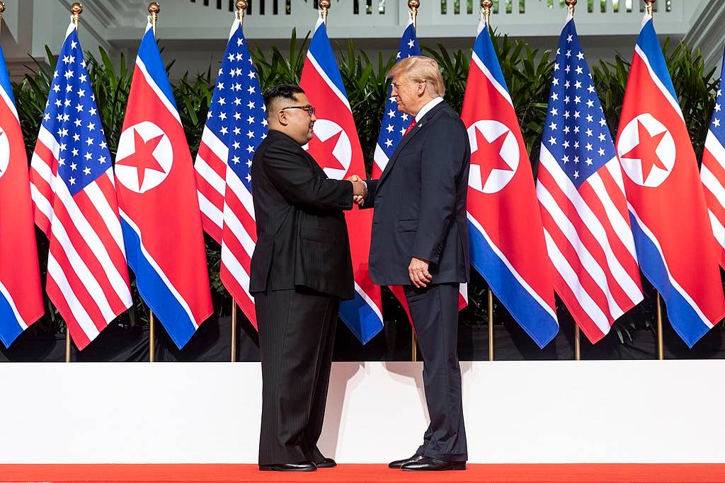 Kim and U.S. President <a href="https://en.wikipedia.org/wiki/Donald_Trump" target="_blank" rel="noreferrer noopener">Donald Trump</a> shake hands at the start of the <a href="https://en.wikipedia.org/wiki/2018_North_Korea%E2%80%93United_States_Singapore_Summit" target="_blank" rel="noreferrer noopener">2018 North Korea–United States Summit</a>, June 2018.