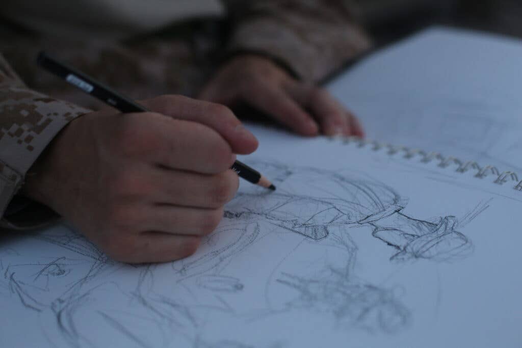 Artist Marine sketching. (U.S. Marine Corps photo by Gunnery Sgt. Jon Spencer)