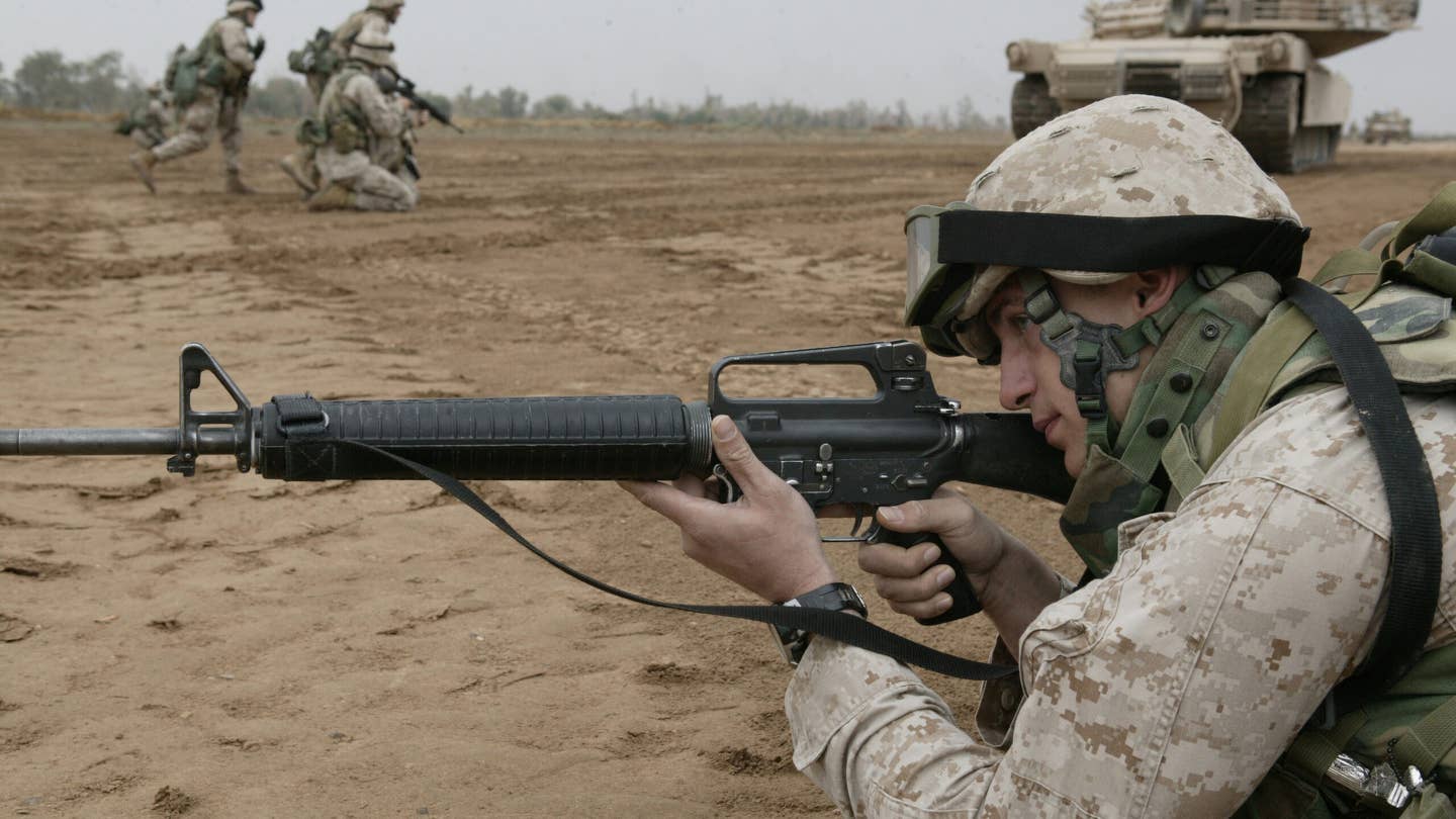 A Marine with Company I, 3rd Battalion, 5th Marine Regiment, sights in his M16A2.