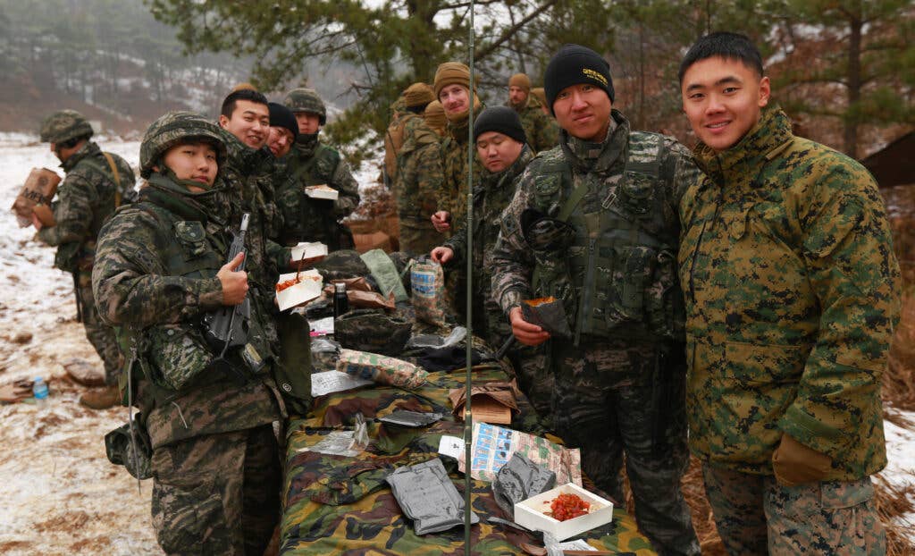 Marines share MRE’s with Republic of Korea Marines at Rodriguez Live Fire Complex, South Korea, Dec. 21, 2015. (U.S. Marine Corps Photo by Lance Cpl. Jorge A. Rosales/Released)