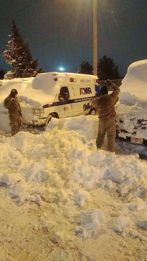 New York National Guard rescue and clear path for ambulance