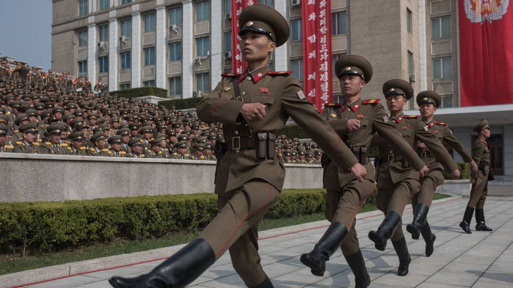 Korean People's Army (KPA) soldiers march to their positions prior to a military parade marking the 105th anniversary of the birth of late North Korean leader Kim Il-Sung, in Pyongyang on April 15, 2017.   / AFP PHOTO / ED JONES/AFP via Getty Images 