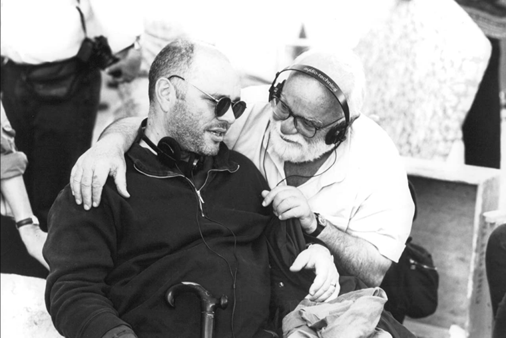 Director Anthony Minghella and Saul Zaentz on the set of <em>The English Patient</em>.