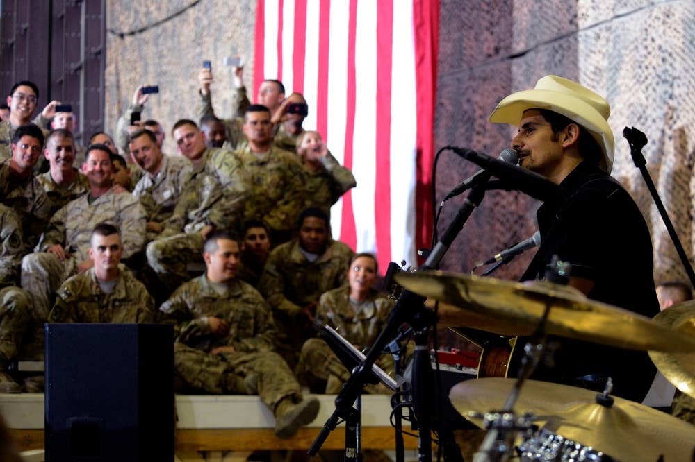 <em>Paisley made a surprise visit to troops in Afghanistan with President Obama in 2014 (U.S. Air Force)</em>