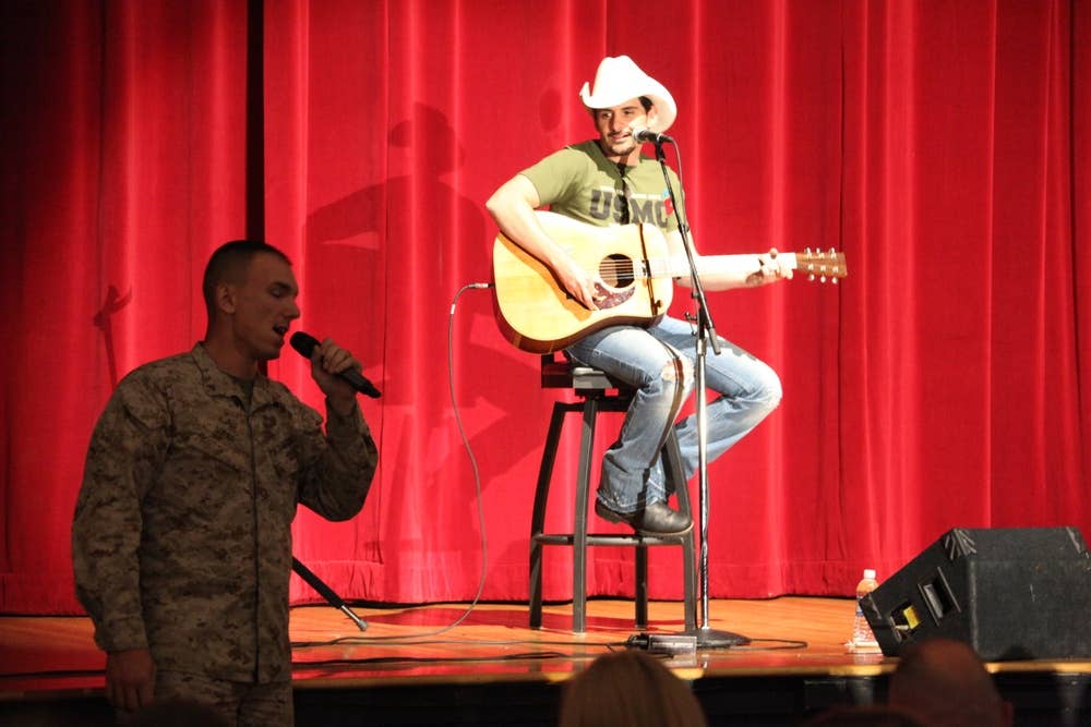 <em>Paisley sings with Lance Cpl. Matthew Spoke during a performance at MCAS Miramar (U.S. Marine Corps)</em>