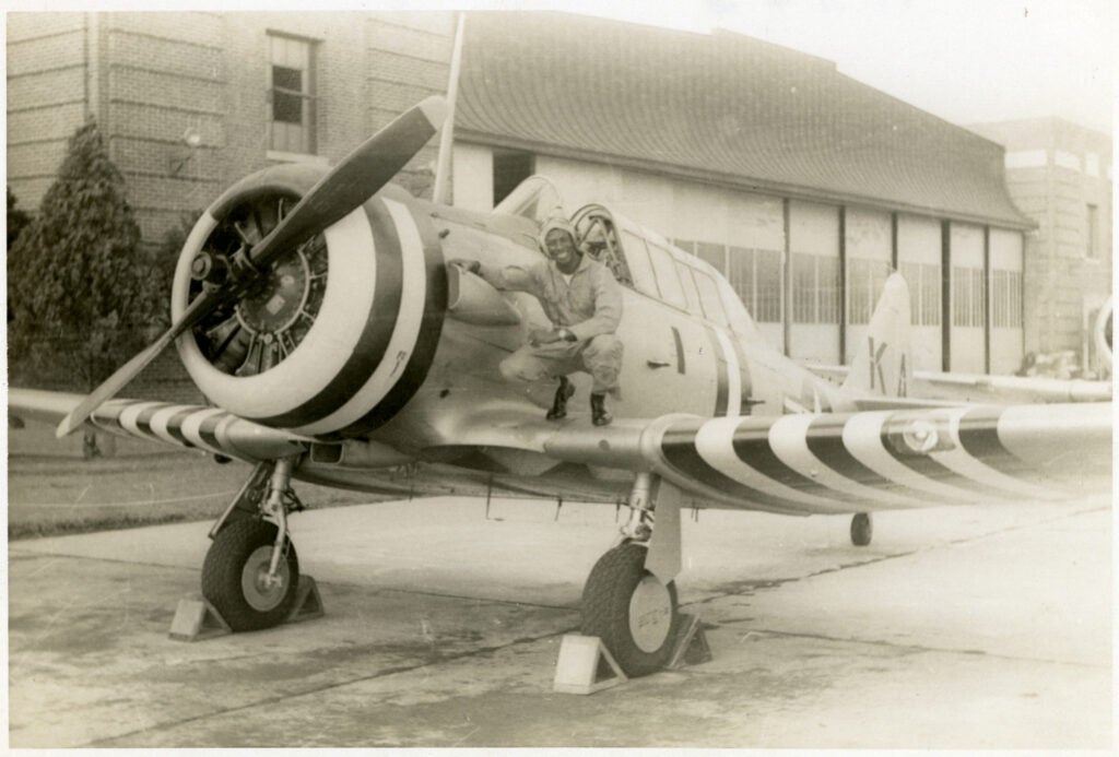 jesse l. brown with his aircraft