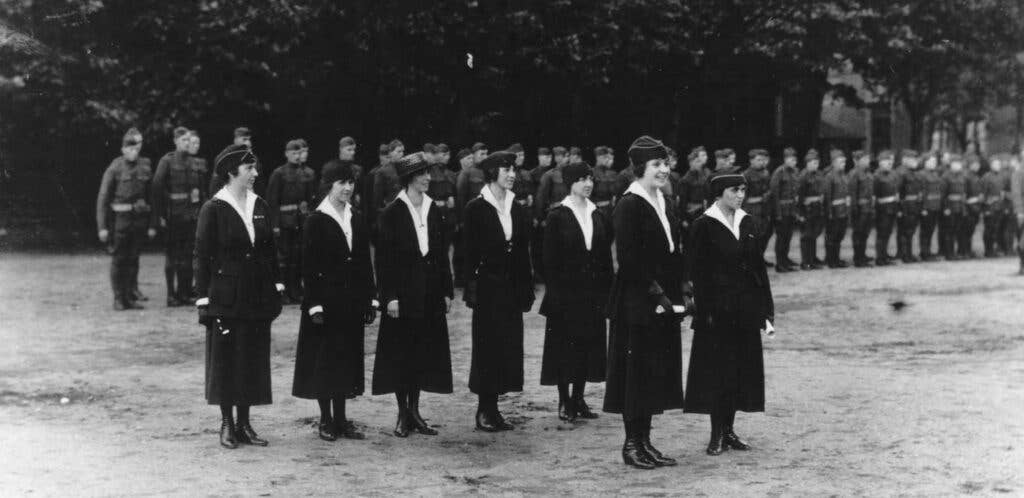 Grace Banker, front left, and some of her colleagues in the Signal Corp Hello Girls line up before receiving recognition for their work in France during World War I.