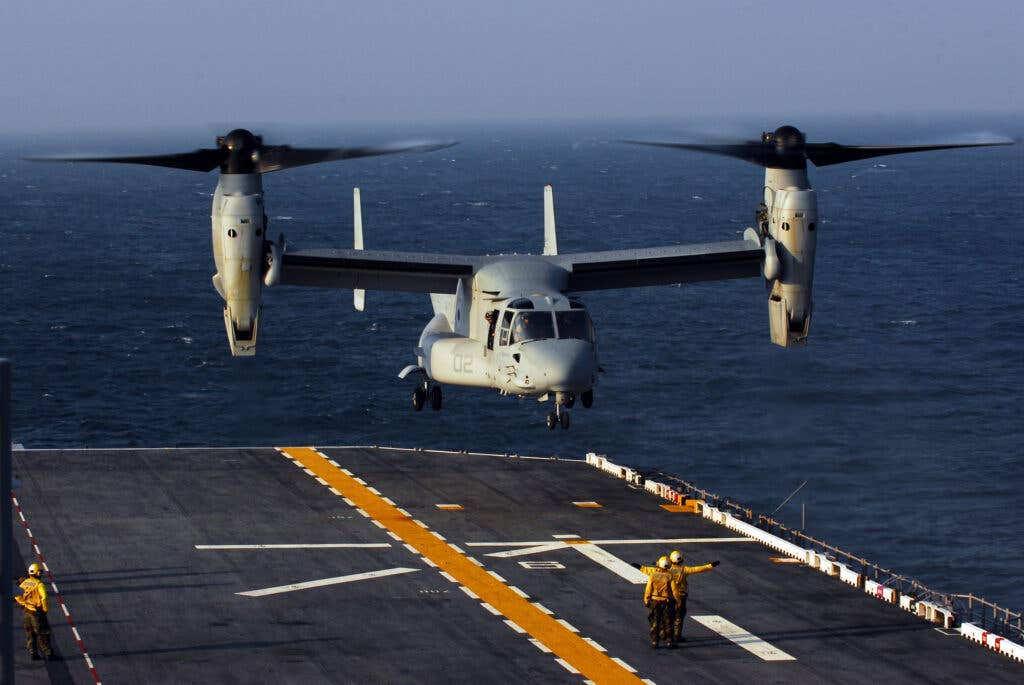 A V-22 Osprey aircraft from the "Thunder Chickens" of Marine Medium Tiltrotor Squadron 263 conducts landing qualifications aboard the multi-purpose amphibious assault ship USS Bataan.