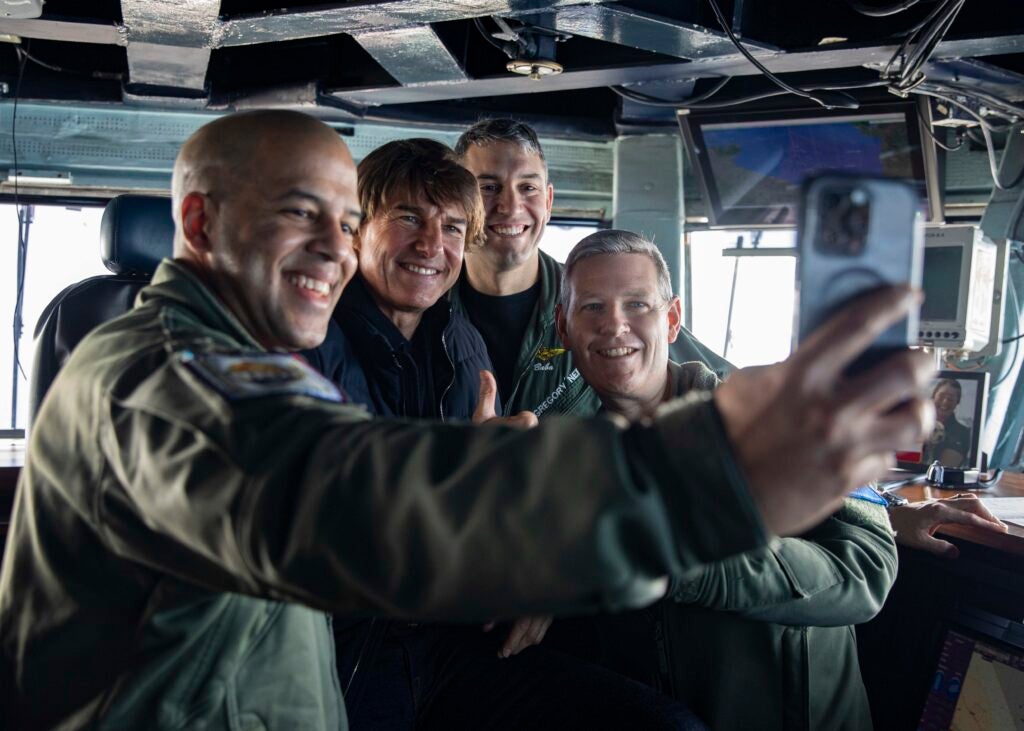 tom cruise visits navy ship and takes a selfie
