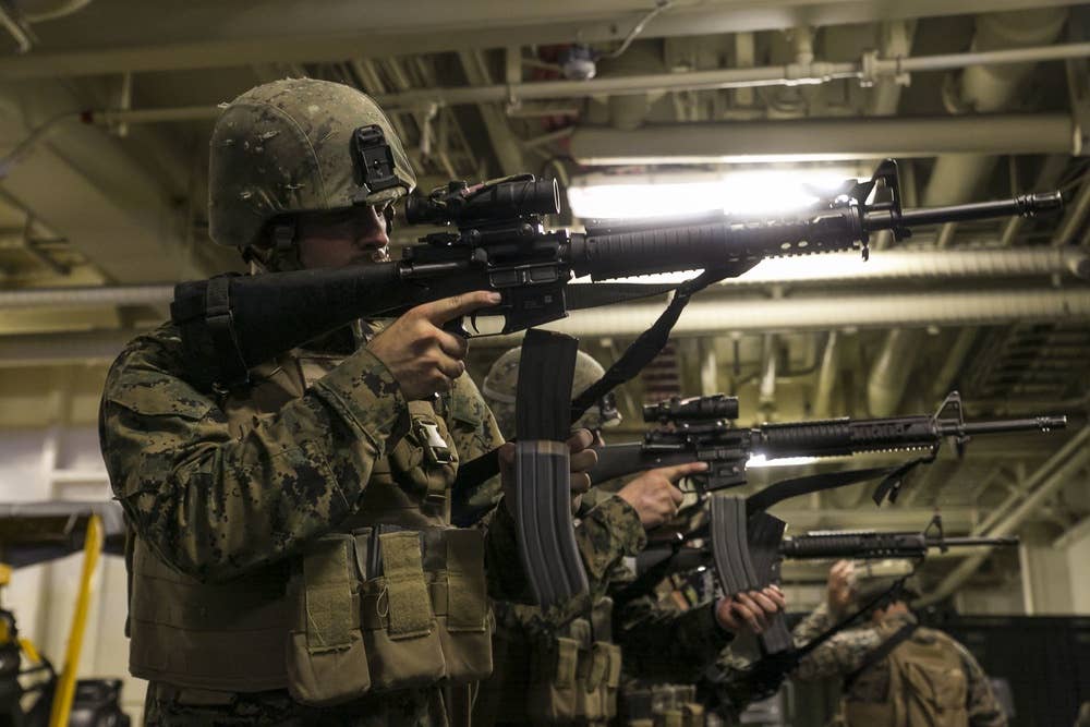 marines reloading rifle magazines