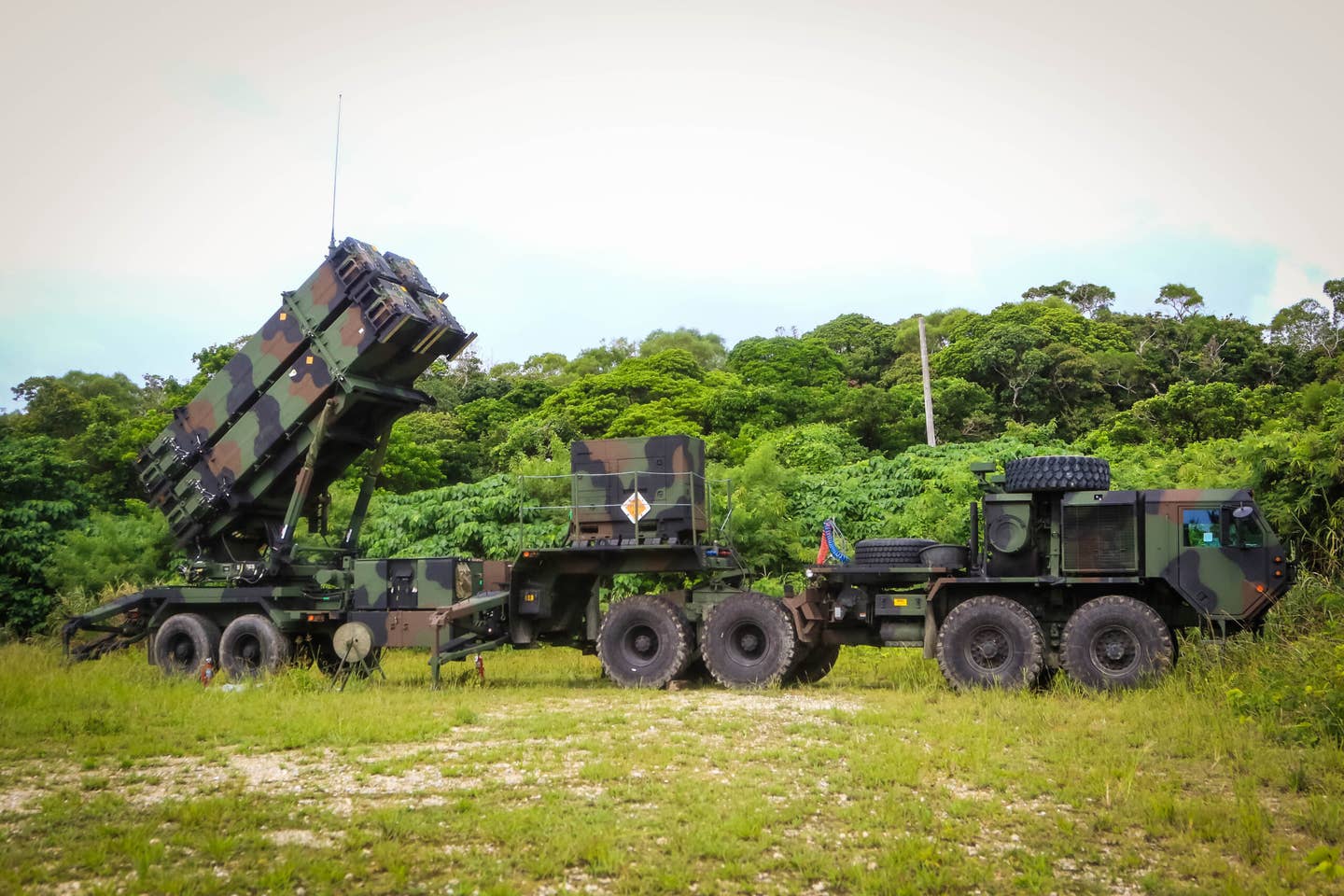 A patriot missile launcher system part of 1st Battalion, 1st Air Defense Artillery Regiment, sits in a training area during the unit’s table gunnery training exercise on Kadena Air Base in Japan, Oct. 19, 2017.  (U.S. Army Photo by Capt. Adan Cazarez)