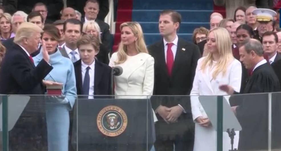 Screenshot of swearing in, left to right: Donald Trump, wife Melania, children Don Jr., Barron, Ivanka, Eric, and Tiffany, with Chief Justice John Roberts administering oath.