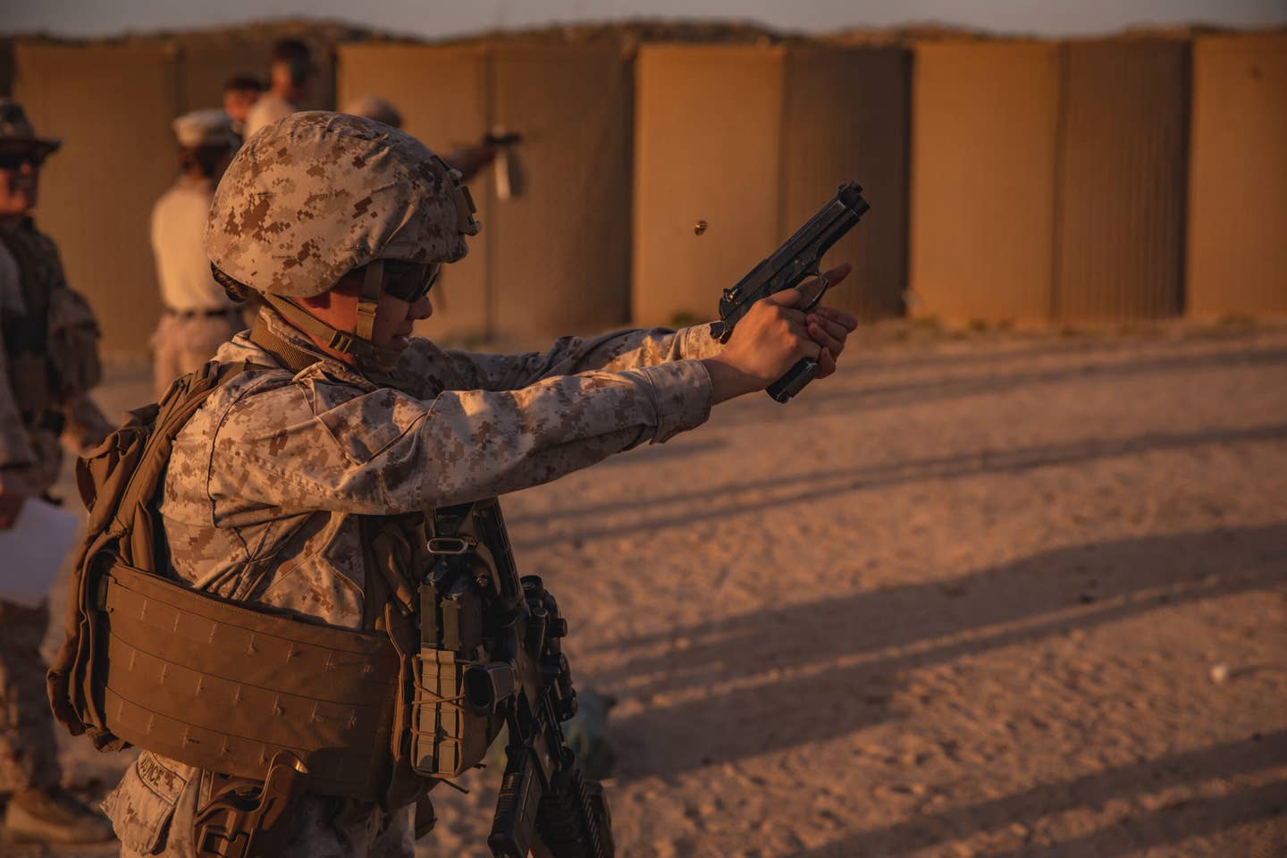 <em>A full-size, metal-frame 9mm pistol has very little recoil, unless you don't have a good grip on it (U.S. Marine Corps)</em>