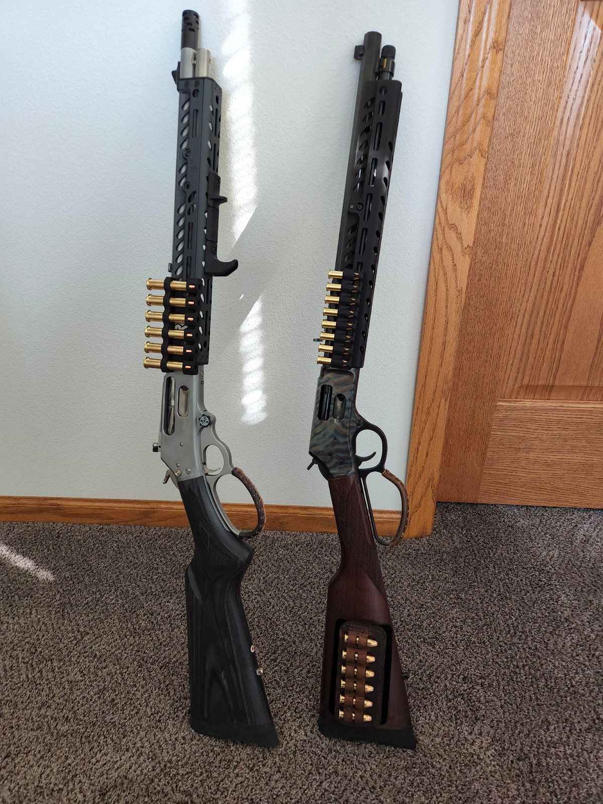 two modern lever action rifles