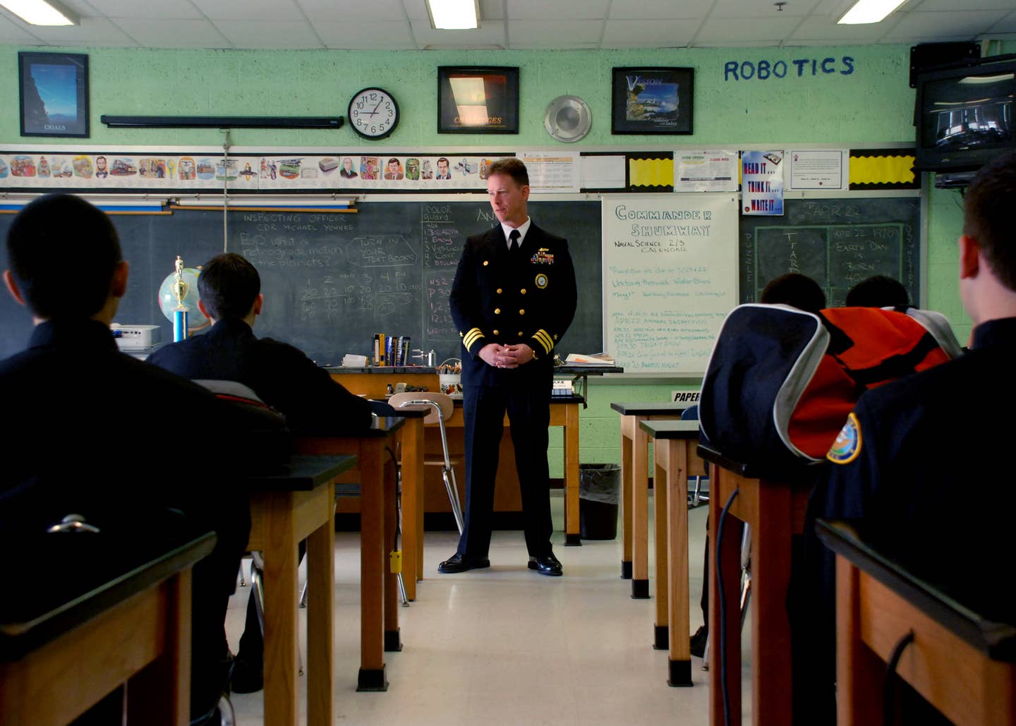 military recuiter at a school classroom during military recruiting crisis period.