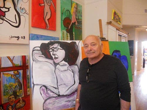 Burt Young with some of his paintings.