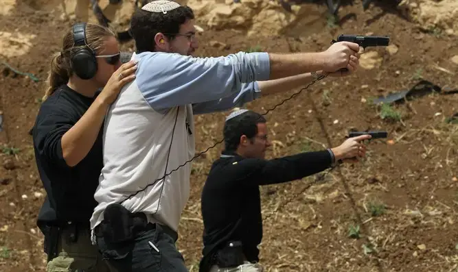 Israeli Tactical Training Academy students firing at pistol range.