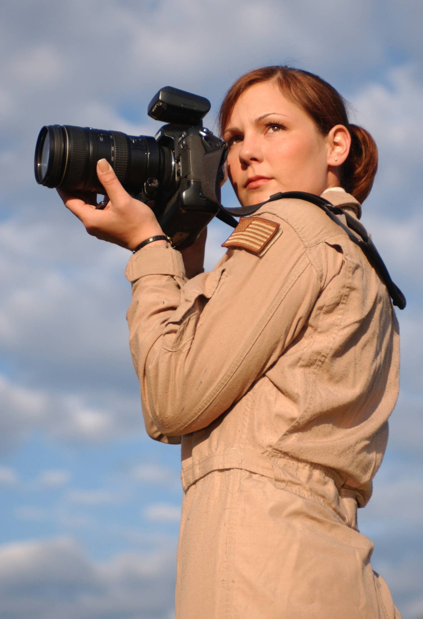 Stacy Pearsall with a camera.