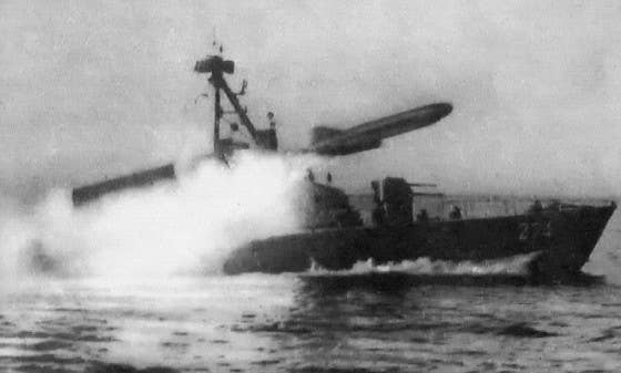 A Soviet Komar-class missile boat, like the ones used by the Syrian Navy, fires a Styx missile.