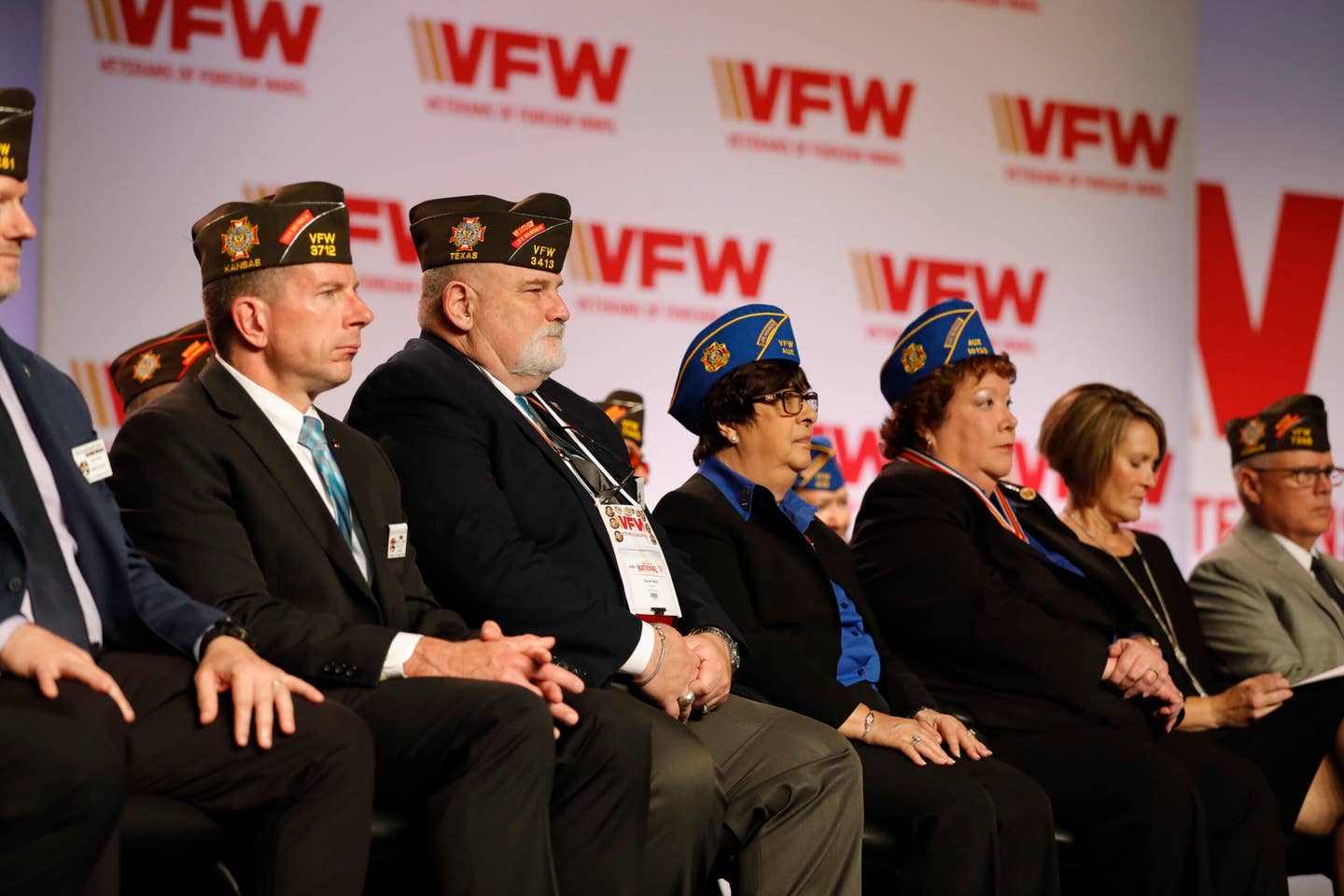 VFW veterans sitting on stage.