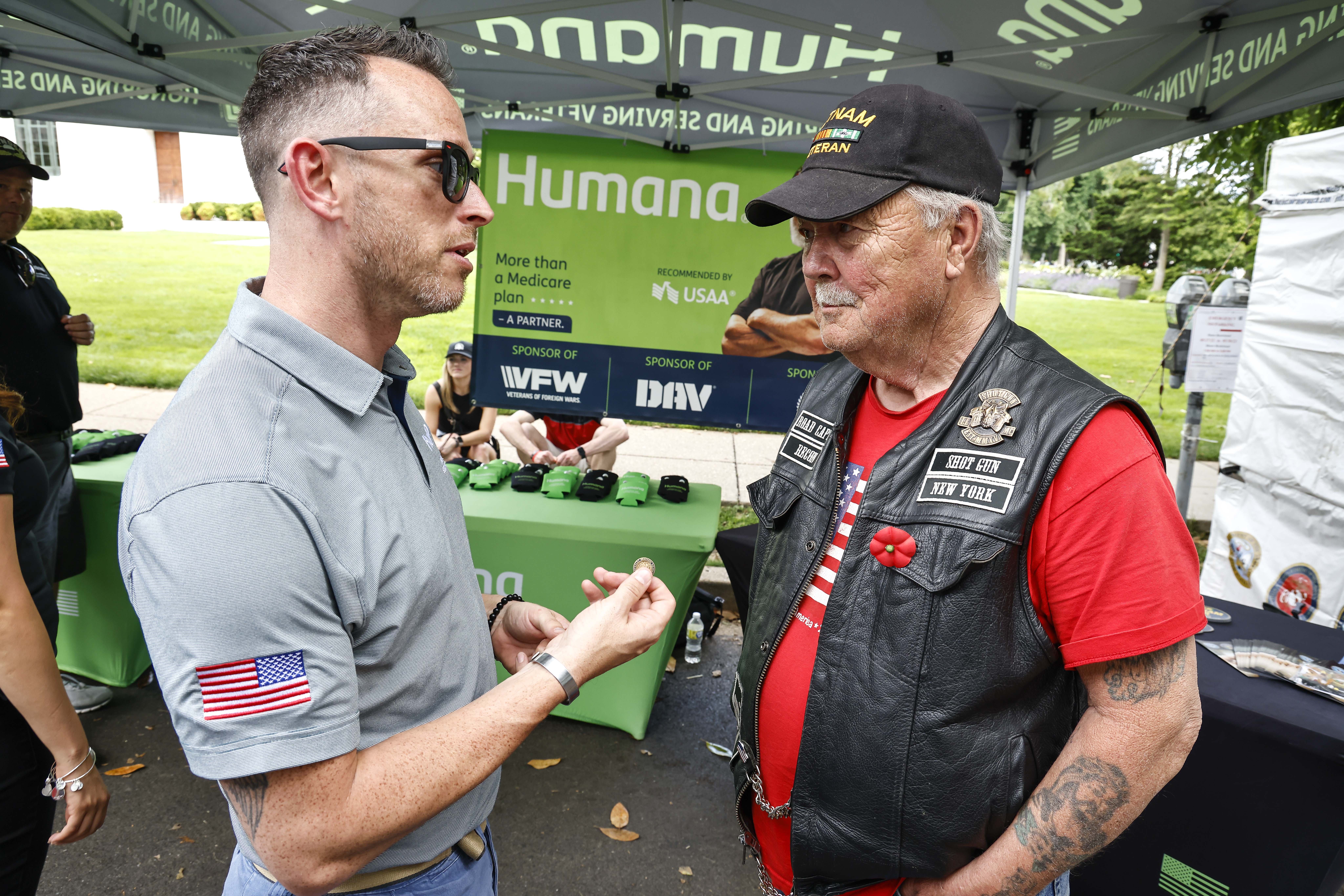 Humana veterans group talking to veteran.
