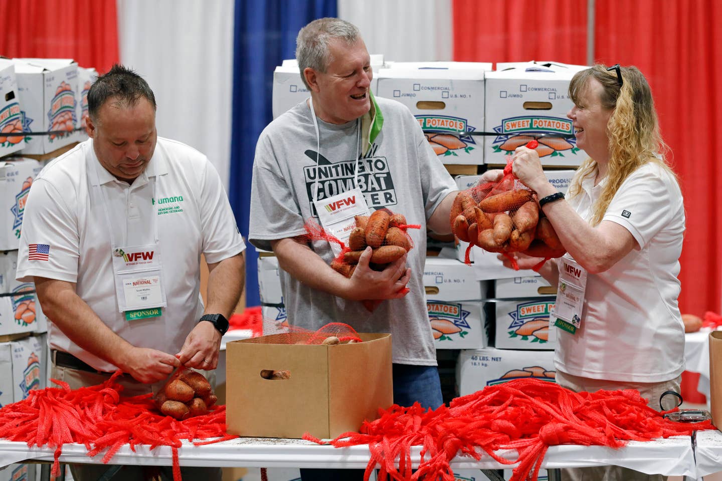 Volunteers packing sweet potatoes.