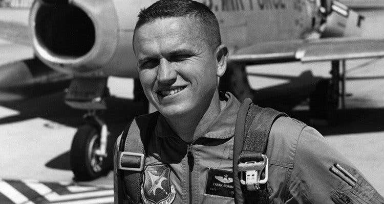<em>Borman poses in front of an F-86 Sabre (Public Domain)</em>