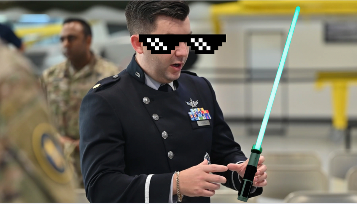 a man holds a light saber