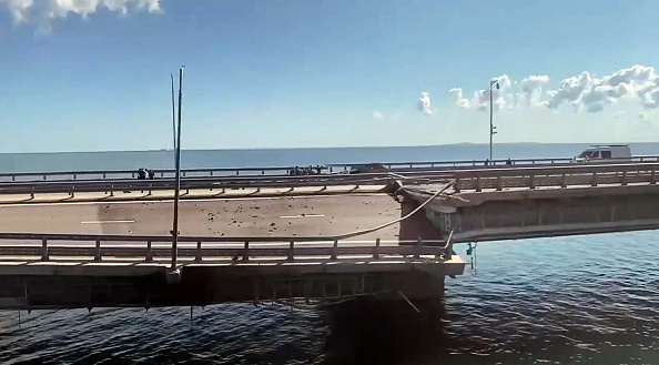 TOPSHOT - This video grab taken from a rimea24TV footage on July 17, 2023 shows the damaged Kerch bridge -- linking Crimea to Russia -- which was heavily damaged following an attack. Russia on July 17, 2023, said a Ukrainian attack on the bridge linking Moscow-annexed Crimea to the Russian mainland killed a civilian couple and wounded their child. Moscow said two drones had hit the bridge in the early hours and blamed "the Kyiv regime." (Photo by Crimea24TV / AFP) (Photo by -/Crimea24TV/AFP via Getty Images)