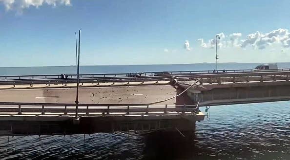 This video grab taken from a rimea24TV footage on July 17, 2023 shows the damaged Kerch bridge -- linking Crimea to Russia -- which was heavily damaged following an attack. Russia on July 17, 2023, said a Ukrainian attack on the bridge linking Moscow-annexed Crimea to the Russian mainland killed a civilian couple and wounded their child. Moscow said two drones had hit the bridge in the early hours and blamed "the Kyiv regime." (Photo by -/Crimea24TV/AFP via Getty Images)